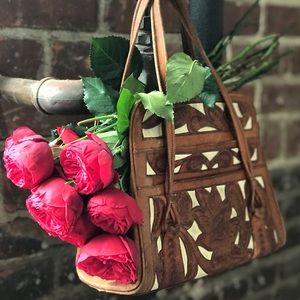 Vintage two-tone Tooled leather bag.